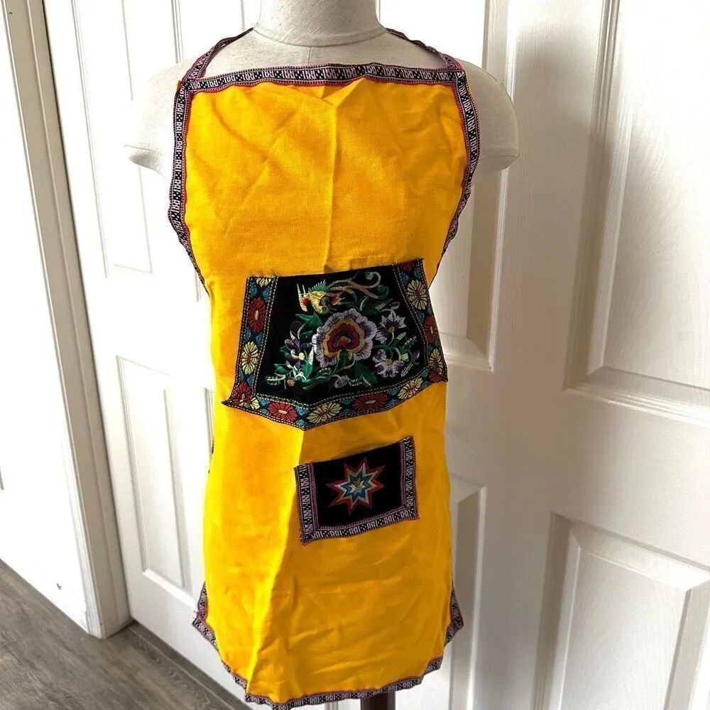 Yellow hand embroidered apron
